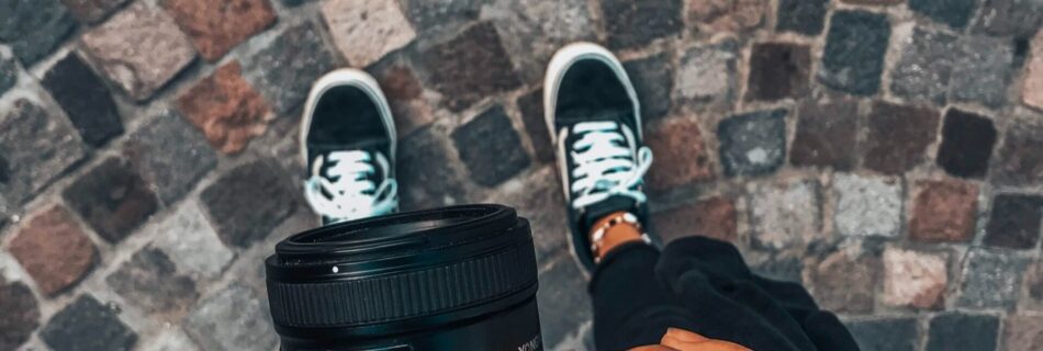 person holding black dslr camera