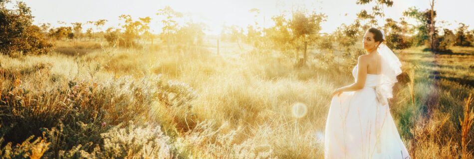 woman in white gown on grassland