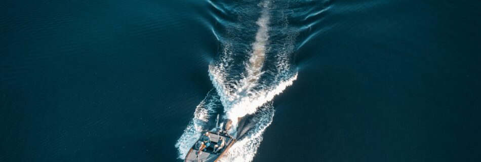 a small boat in the middle of a body of water